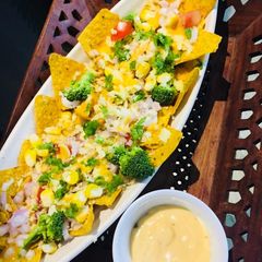 A picture of Cheesy Nachoes Jalapeno veggies with salsa.