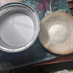 Appam with coconut milk A picture of Appam with coconut milk.