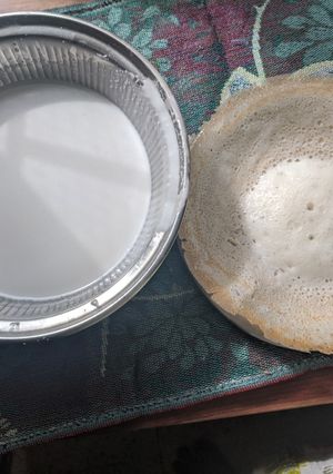 A picture of Appam with coconut milk.