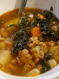 A picture of Sausage, bean, kale stew.