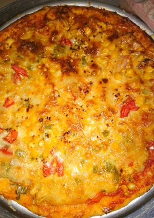 A picture of Pizza in tikka boti at home.