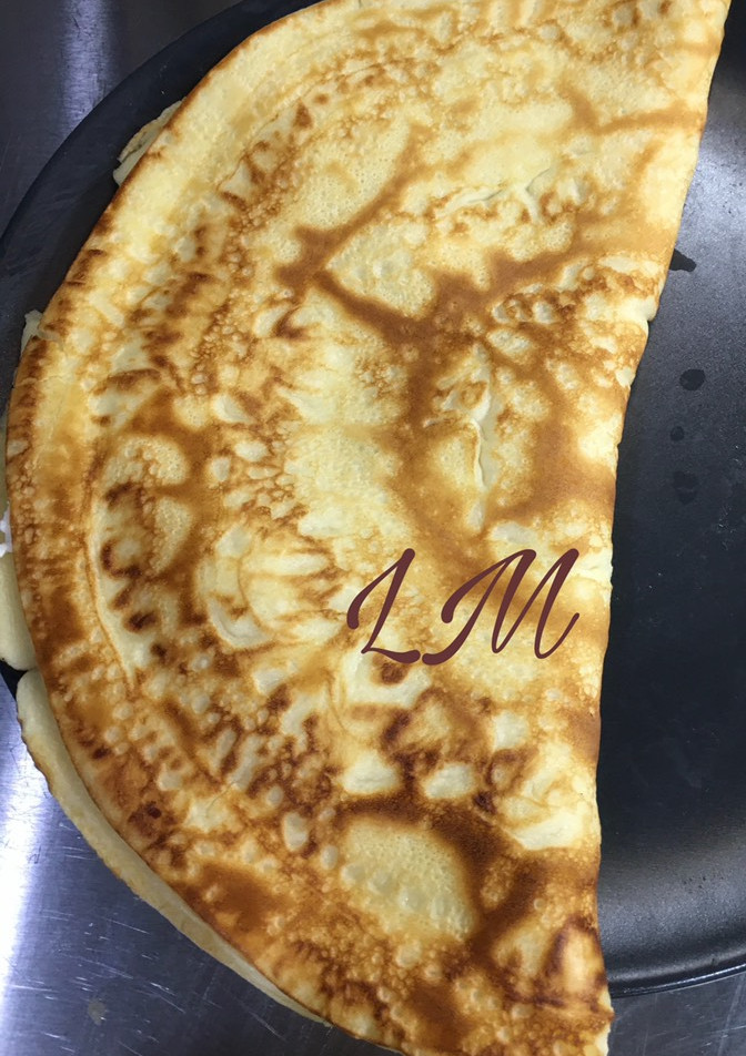 Una foto de Creps rellenas de queso de cabra y cebolla caramelizada