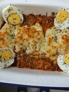 Una foto de Pastel horneado de carne con puré, jamón y ricotta