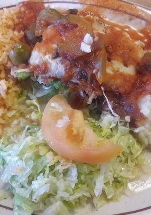 Una foto de Filetes de pescado en salsa roja