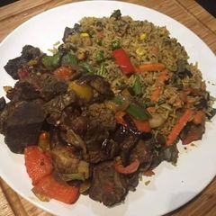 Jollof rice with carrots,green bell pepper A picture of Jollof rice with carrots,green bell pepper.