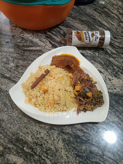 A picture of Savoury rice with grilled fish sauce and Avocado salad.