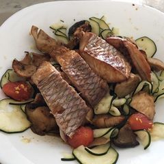 A picture of Grilled fish with zucchini Salad.