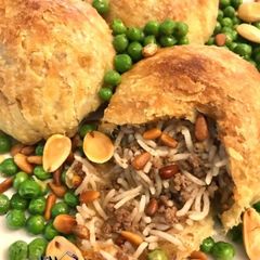 A picture of Ouzzi#A_Flaky_Lebanese_Puff_Pastry_Pouch_Stuffed_With_Rice_Gr.