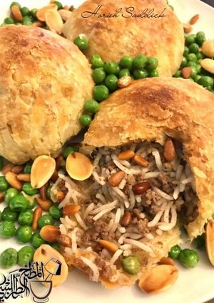 A picture of Ouzzi#A_Flaky_Lebanese_Puff_Pastry_Pouch_Stuffed_With_Rice_Gr.
