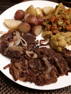 A picture of Fried Calf liver and onions.