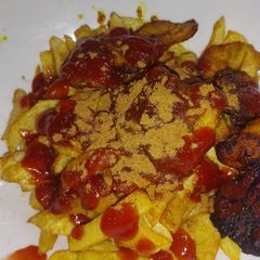 Chips with ketchup A picture of Chips with ketchup.