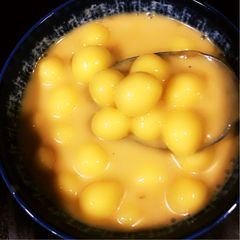 A picture of Paal Kozhukattai (Rice dumplings in sweetened coconut milk).