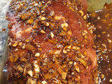 Bondiola de cerdo en salsa de naranja y comino