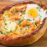 A picture of Khachapuri (cheese-filled bread) (Georgia).