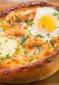 A picture of Khachapuri (cheese-filled bread) (Georgia).