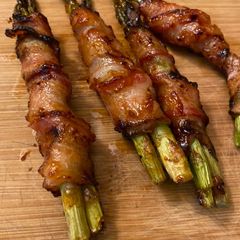A picture of Bbq bacon wrapped asparagus.