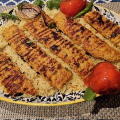 A picture of Persian Kababs with saffron rice (kebob Tabei).