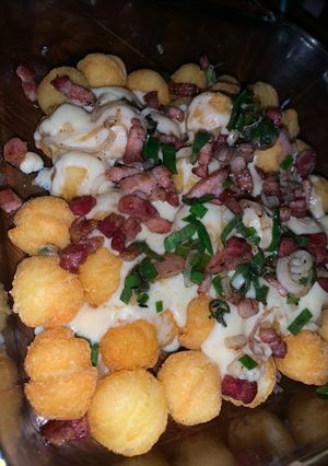 Una foto de Papas con salsa de queso