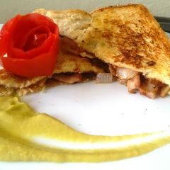 A picture of Bacon and onion sandwich.