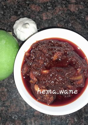 A picture of Raw mango,garlic pickle.