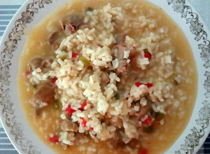 Una foto de Arroz caldoso con mollejas de pollo