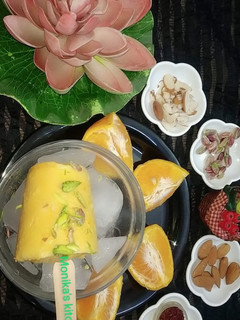A picture of Orange flavour dry fruit kulfi.