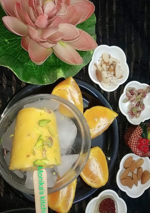 A picture of Orange flavour dry fruit kulfi.