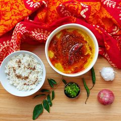A picture of Panchratna Dal tadka with jeera rice.