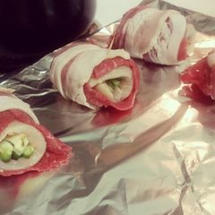 A picture of Chicken stuffed bacon wrap.