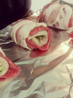 A picture of Chicken stuffed bacon wrap.