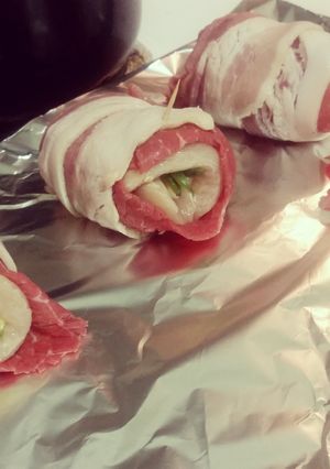 A picture of Chicken stuffed bacon wrap.