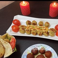 A picture of Falafel, Hummus and Pita Bread.