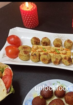 A picture of Falafel, Hummus and Pita Bread.