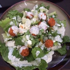 A picture of Crispy Buffalo Quinoa Bites Salad with Cheesy Ranch.