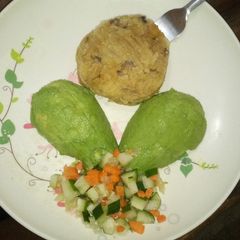 A picture of Mashed matoke and cucumber carrot salad.