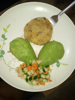A picture of Mashed matoke and cucumber carrot salad.