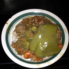A picture of Angie's Crawfish Stew With Stuffed Bell peppers.