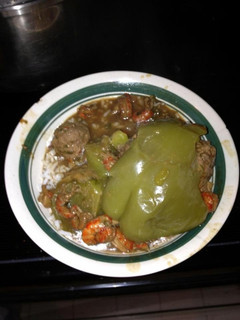 A picture of Angie's Crawfish Stew With Stuffed Bell peppers.