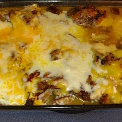 A picture of Baked Granny Smith Apple infused Chicken/with cheese.