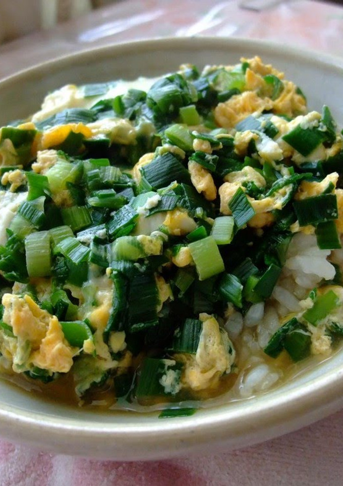 A picture of Chinese Chive and Egg Rice Bowl with Tons of Sauce.