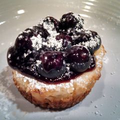 A picture of Mini Lemon and Blueberry Cheesecake Cupcakes.