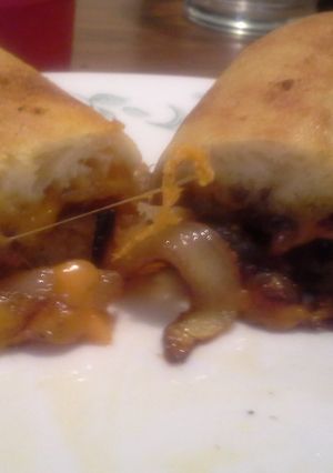 A picture of Caramelized onion and medium cheddar sandwich.
