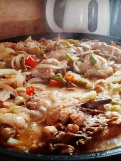 Una foto de Pollo al Disco con Champiñones