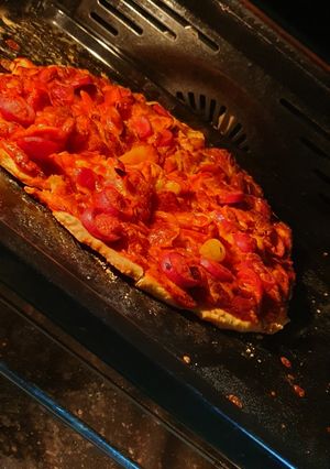 Una foto de Pizza jamón y queso con harina cervecera