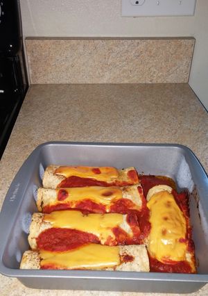 A picture of Shrimp spinach cream cheese Enchiladas.
