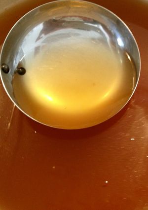 A picture of Golden Consommé Soup with Vegetable Off-Cuts.
