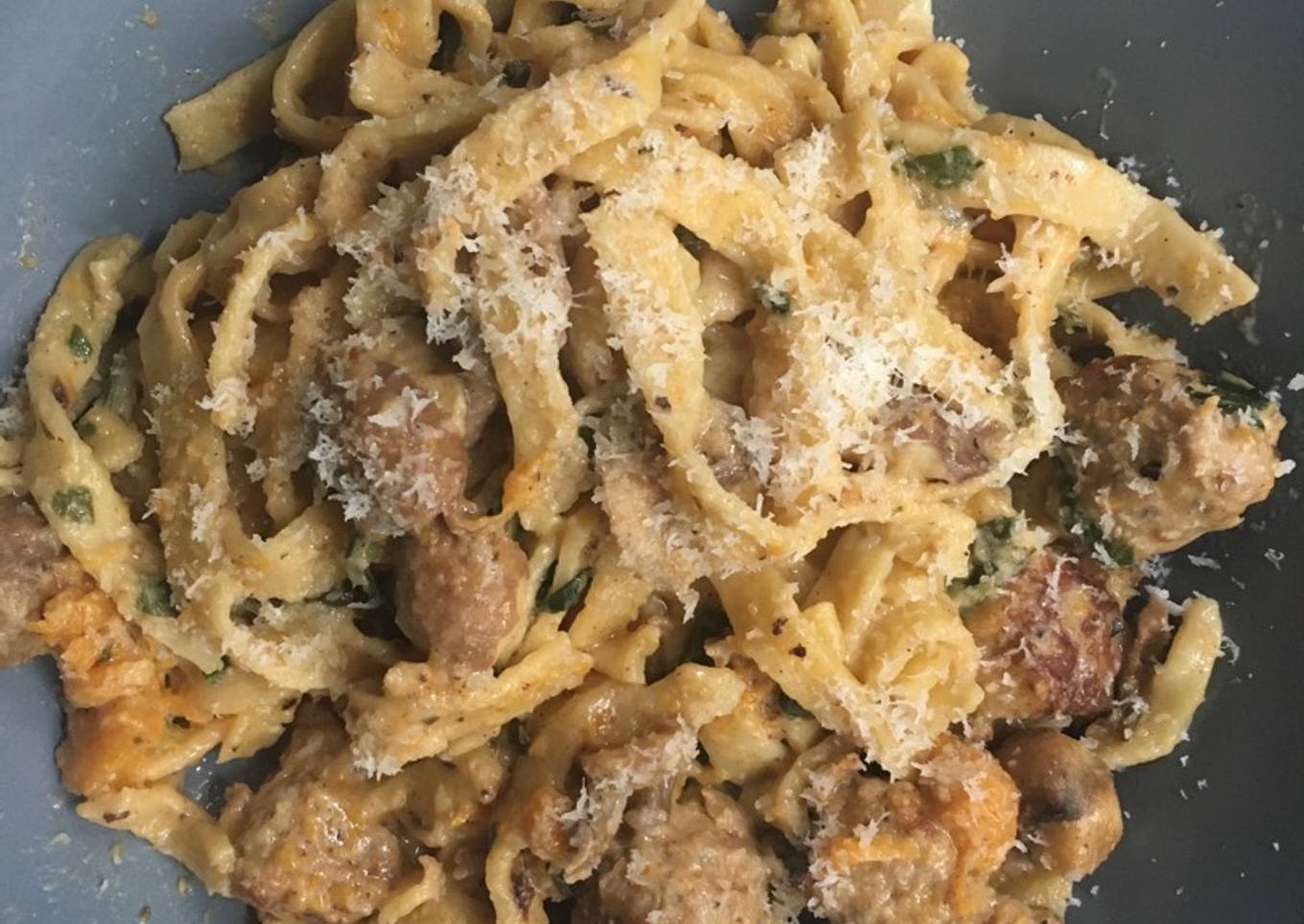 Homemade tagliatelle with pork meatballs and in a creamy sauce