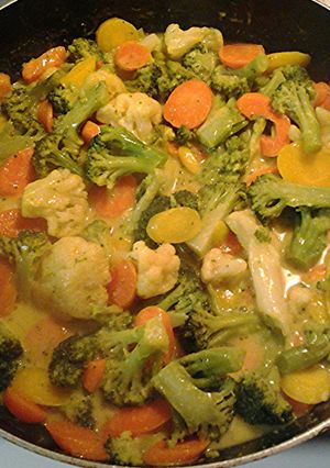 A picture of Vegetables and creamy turmeric sauce.