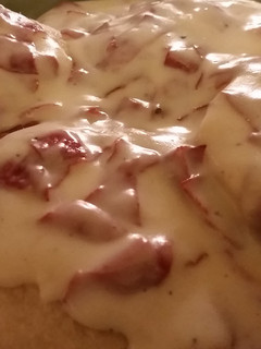 A picture of Chipped Beef with white sauce.