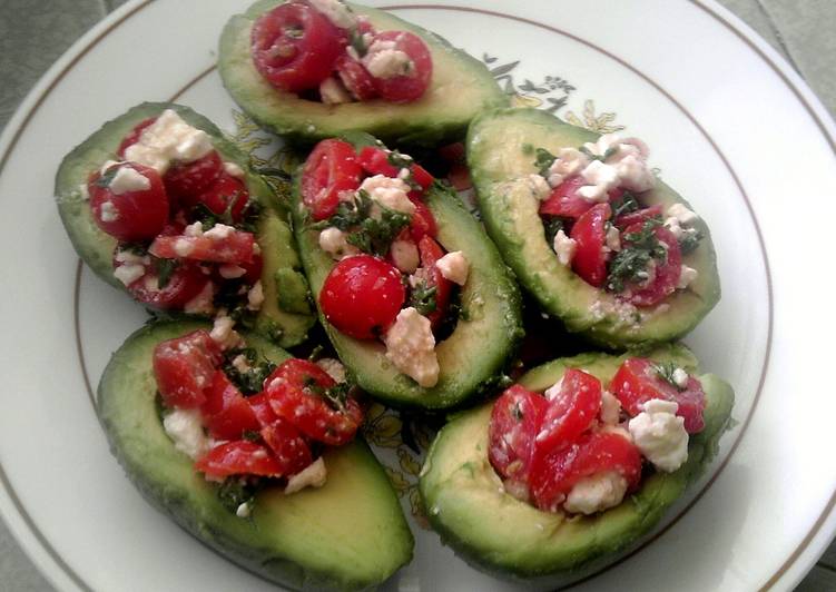 Tomato salad stuffed avocados